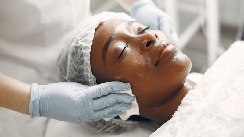 woman getting facial skin treatment