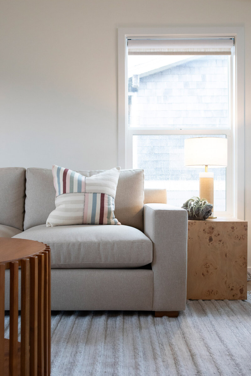 Close up details of a custom beige colored sectional sofa in an Oregon beach house rental.