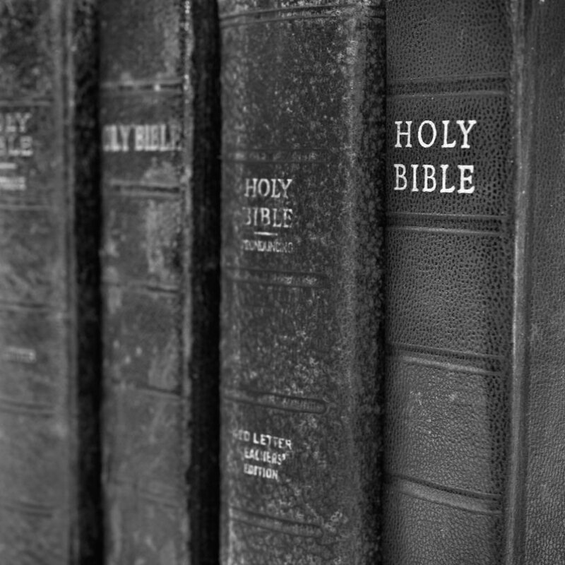old bibles on a shelf