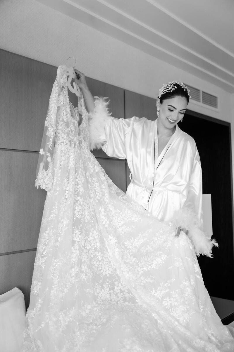 The bride looking at her wedding dress at a wedding at the Four Seasons Orlando by Florida Wedding photographer. 