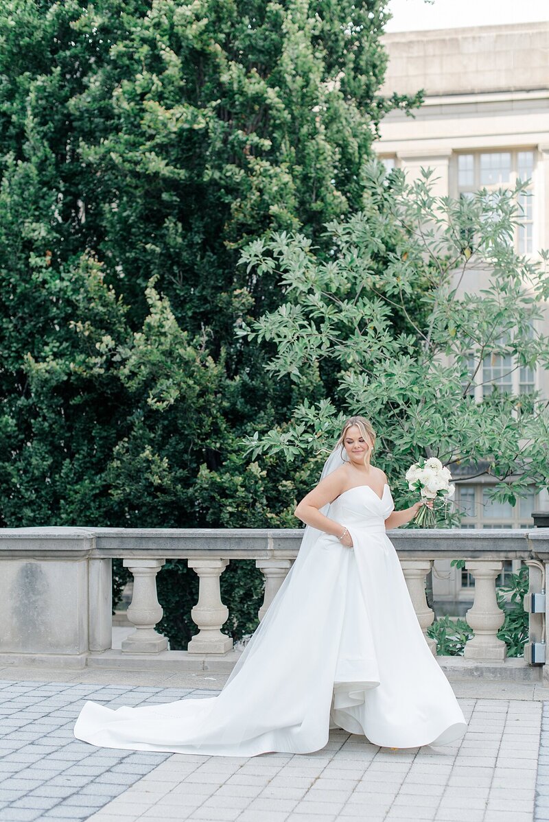 Bride walking holding dress after wedding in Columbus, Ohio