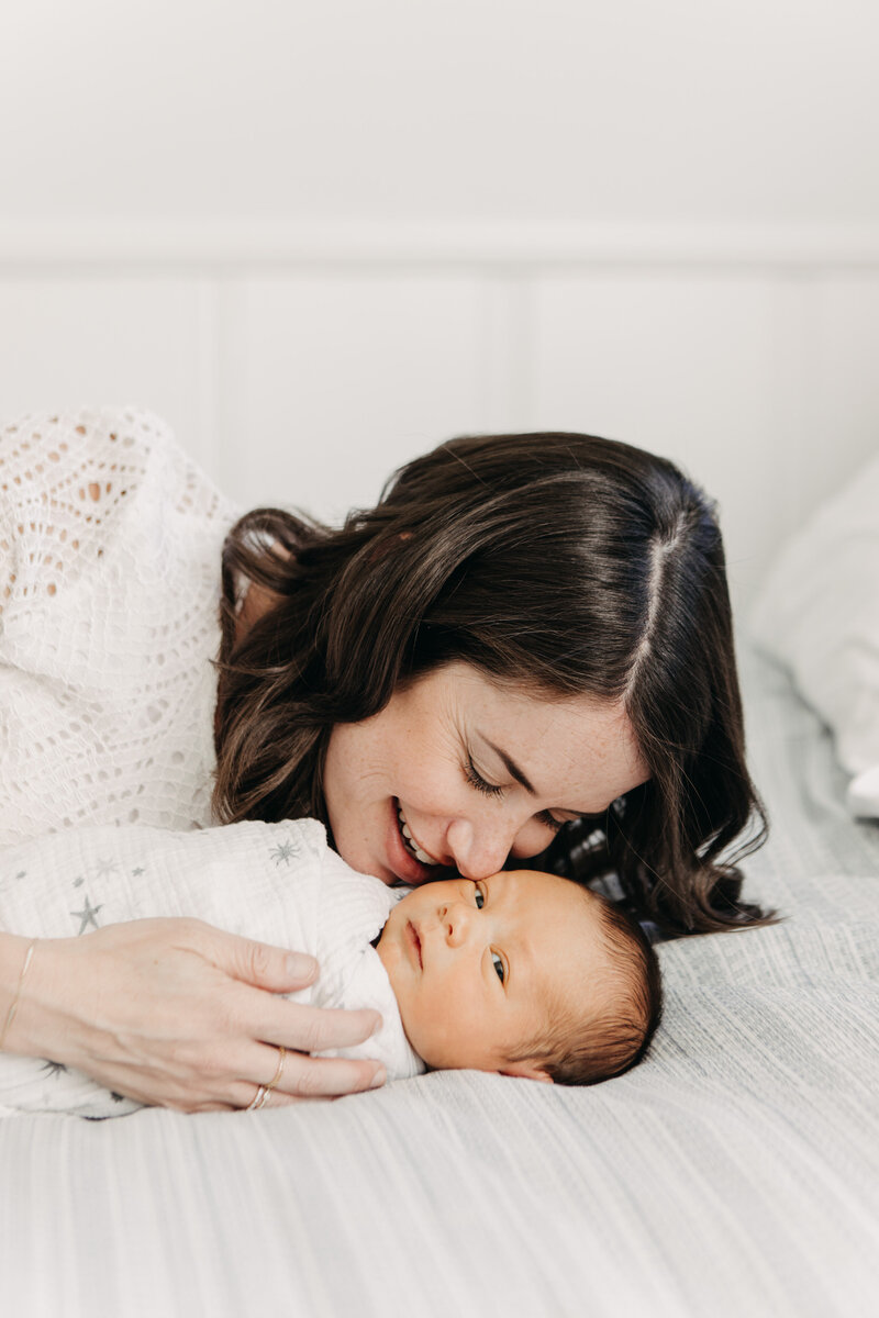 Natural newborn photography with mom and baby.