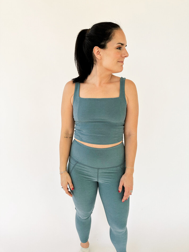 woman wearing blue beyond yoga pocket leggings