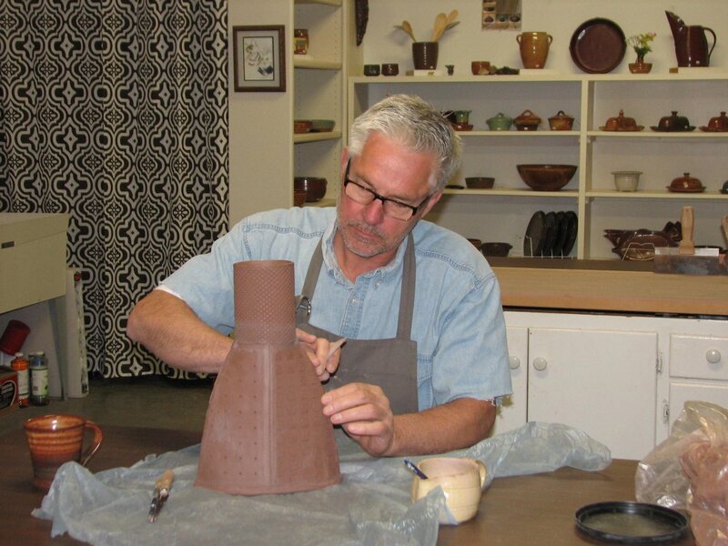 Dick working on his pottery