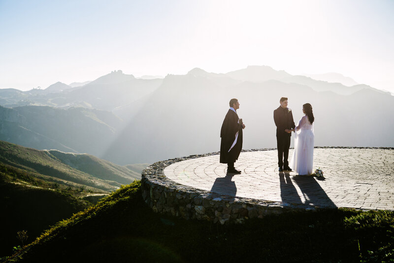 bride and groom exchange vows during outdoor ceremony