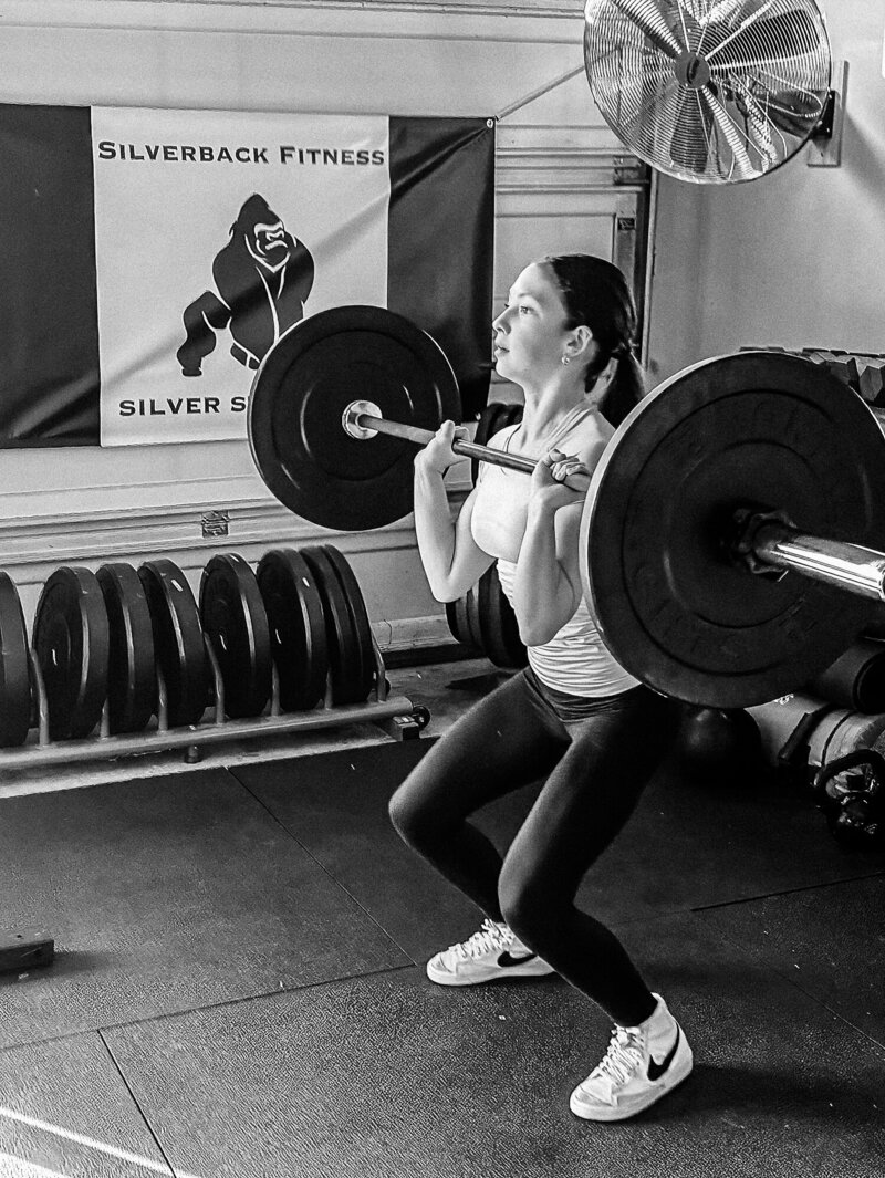 Teen girl is doing a deadlift at Silverback fitness, a personal training studio specializing in teen athletes in Sarnia, Ontario.