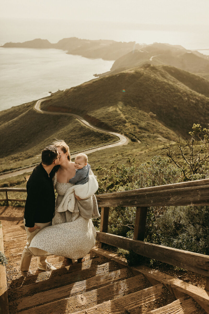 Bay Area lifestyle family couple kissing in Marin Headlands
