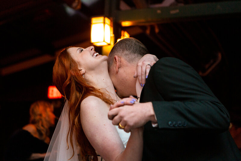 An indie LGBTQ+ couple’s moody editorial wedding portrait, photographed in a true-to-color style by Chelsea Stanford in Missouri
