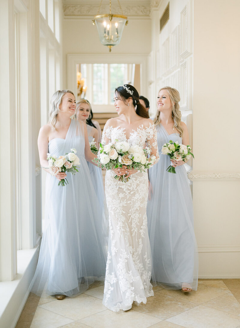 A bride walking with her bridesmaids at The Olana Dallas