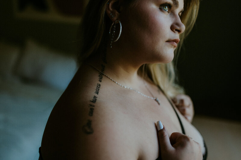 close up photo of a plus size girl's neck tattoo