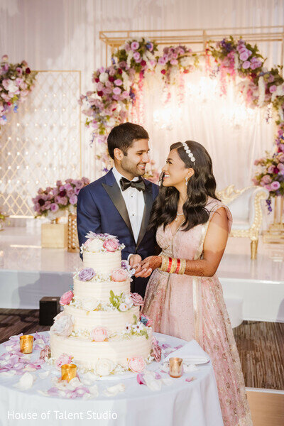 Bride and toom cutting the cake