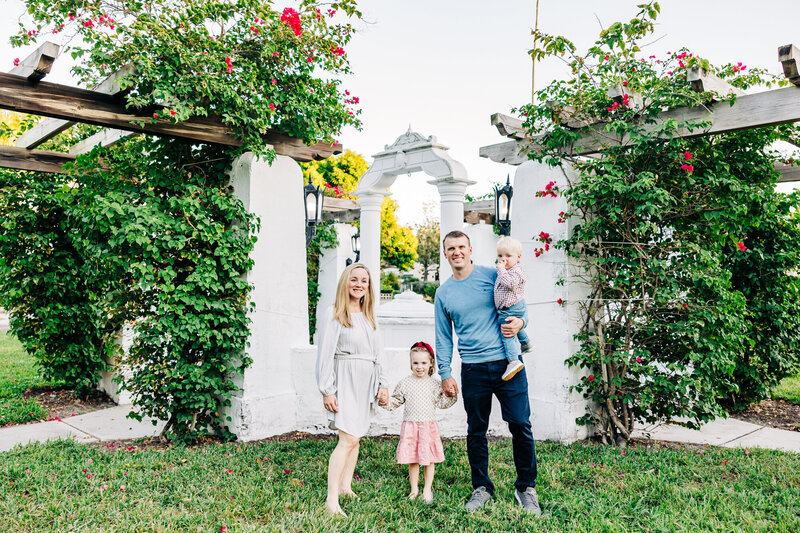 Family portraits with sea grapes and sailboats at USF St. Pete’s waterfront.