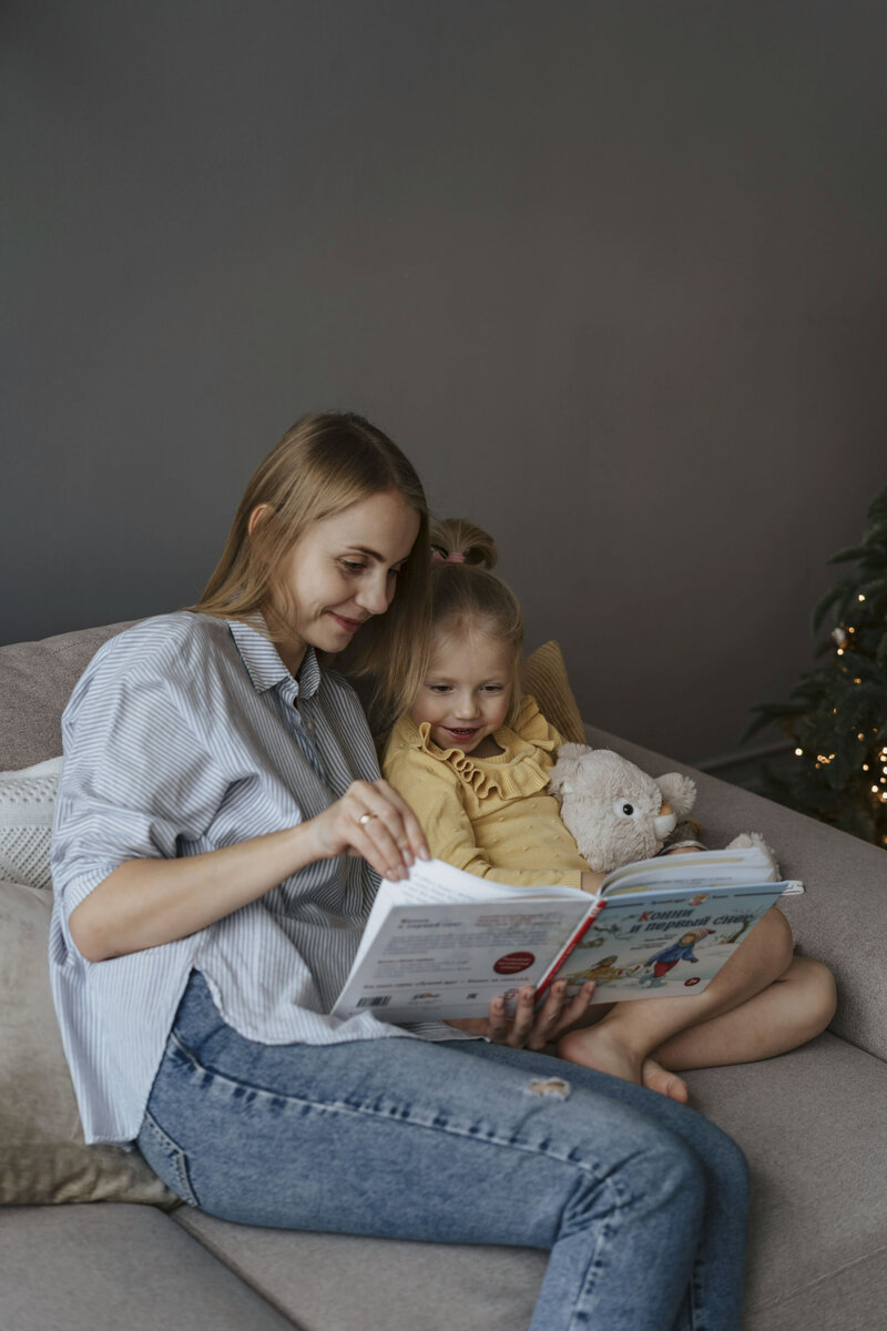 Woman reading to her daughter