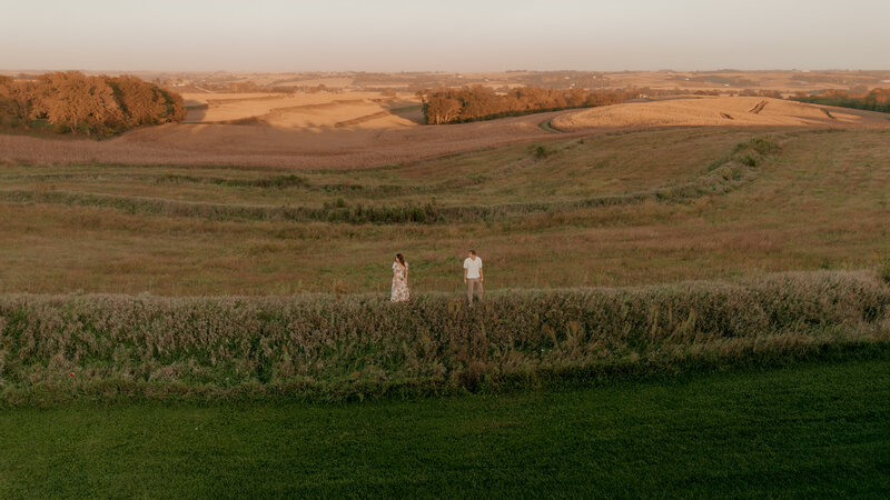 Couple's engagement session in Omaha during golden hour, surrounded by warm fall foliage – captured by Tori Nichole Photography. Authentic, romantic moments in a stunning autumnal setting, reflecting the beauty of the season and their love story.