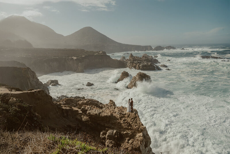 How to Elope in Big Sur bride and groom running along the beach