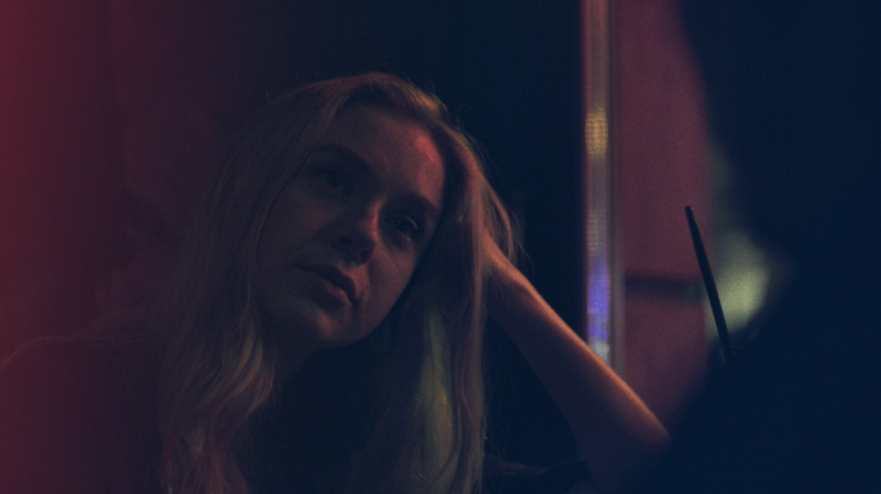 A layered shot using reflections and foreground elements to create depth and rhythm.