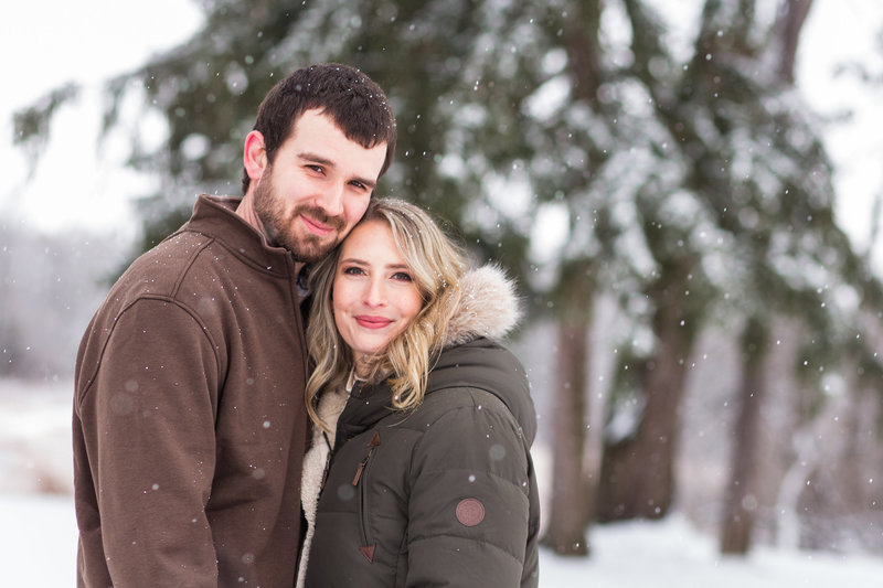 snowy winter engagement photos at quail hollow state park in Hartville Ohio photographed by Jamie Lynette Photography Canton Ohio Wedding Photographer