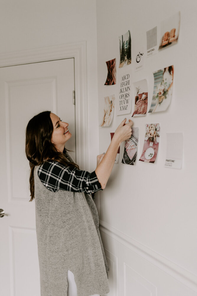 Jordin Brinn analyzing photos to curate a mood board for a web design client.