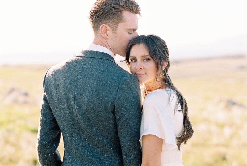 Groom kissing Brides forehead