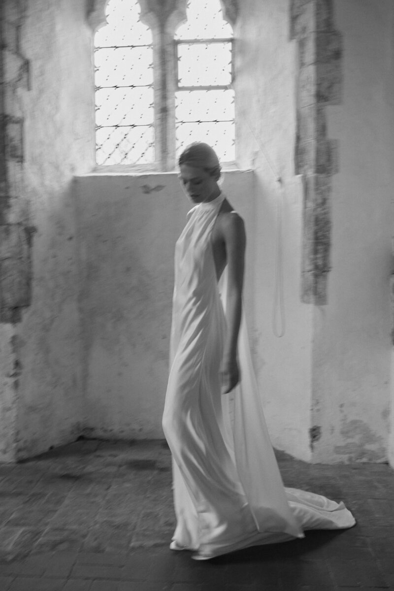Modern flowing wedding dress in silk by British designer