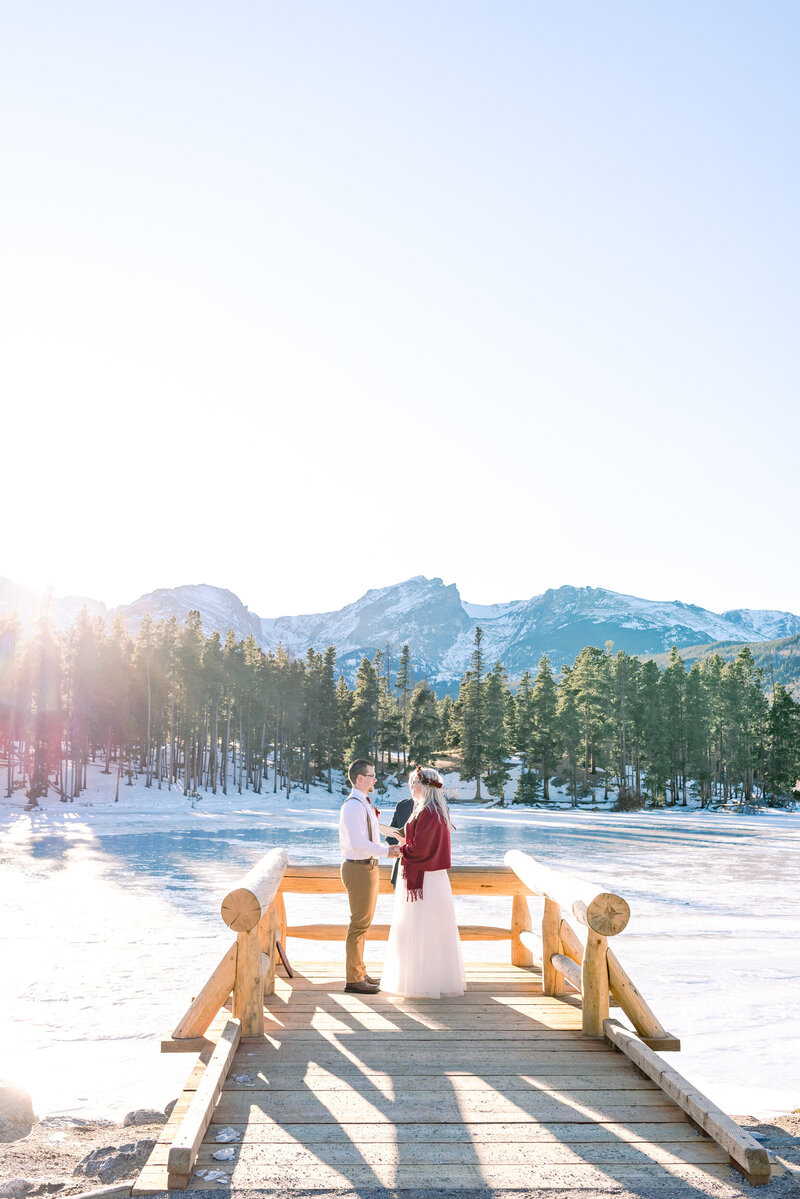 couple eloping in front of mountains