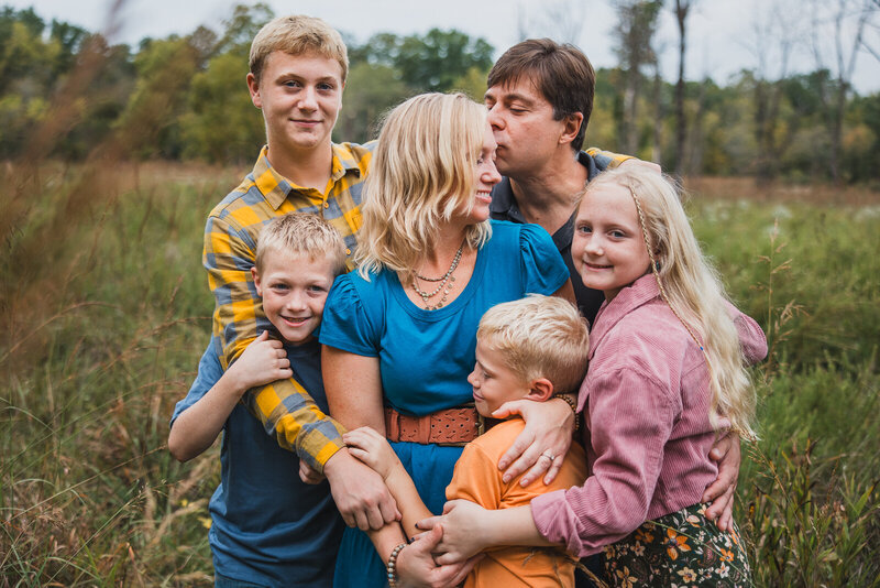 Family portrait taken outdoors in a field in Farmington, Missouri. 