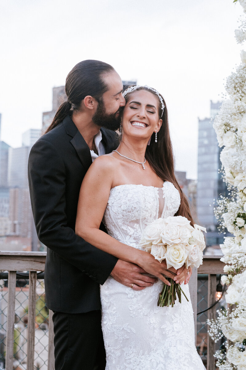 Bride and groom at the Prince Loft  Rooftop Embracing