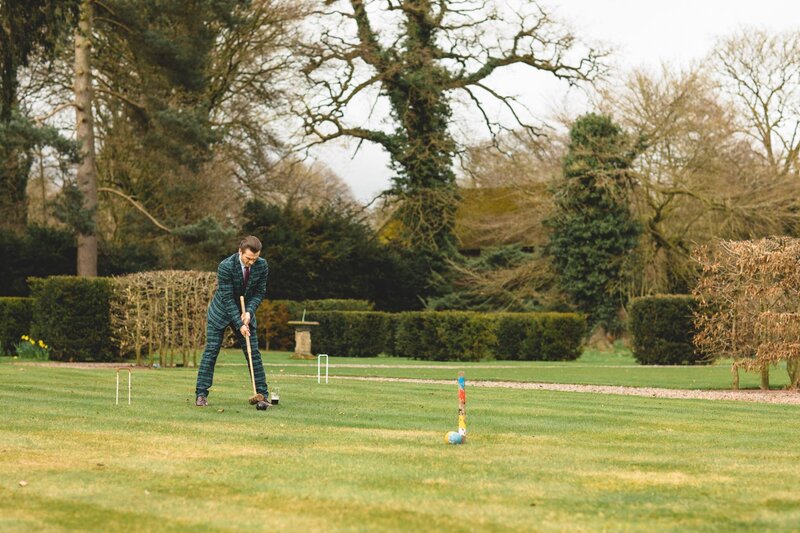 Guest playing croquet in the garden at Iscoyd