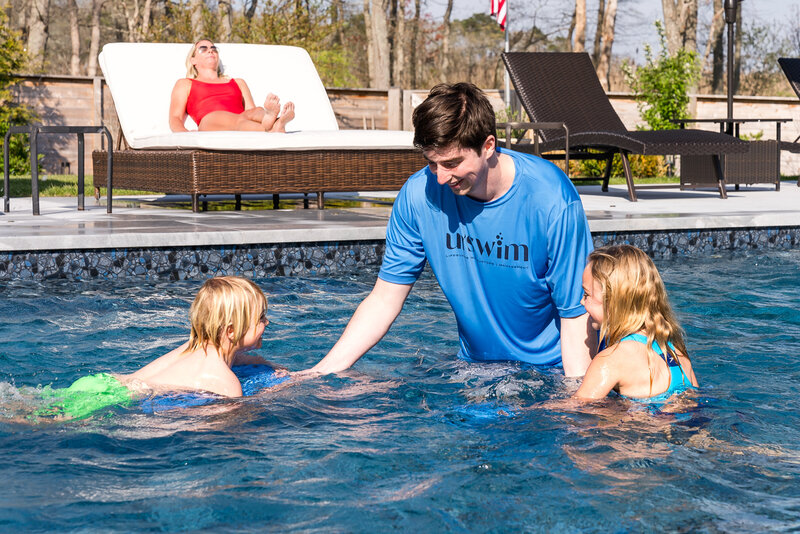 Three kids sitting by the pool, enjoying a moment of leisure and quality bonding time