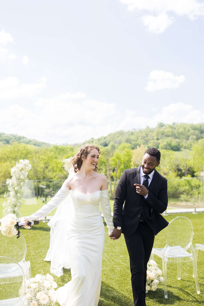 Bride and groom walking back down aisle after Nashville wedding