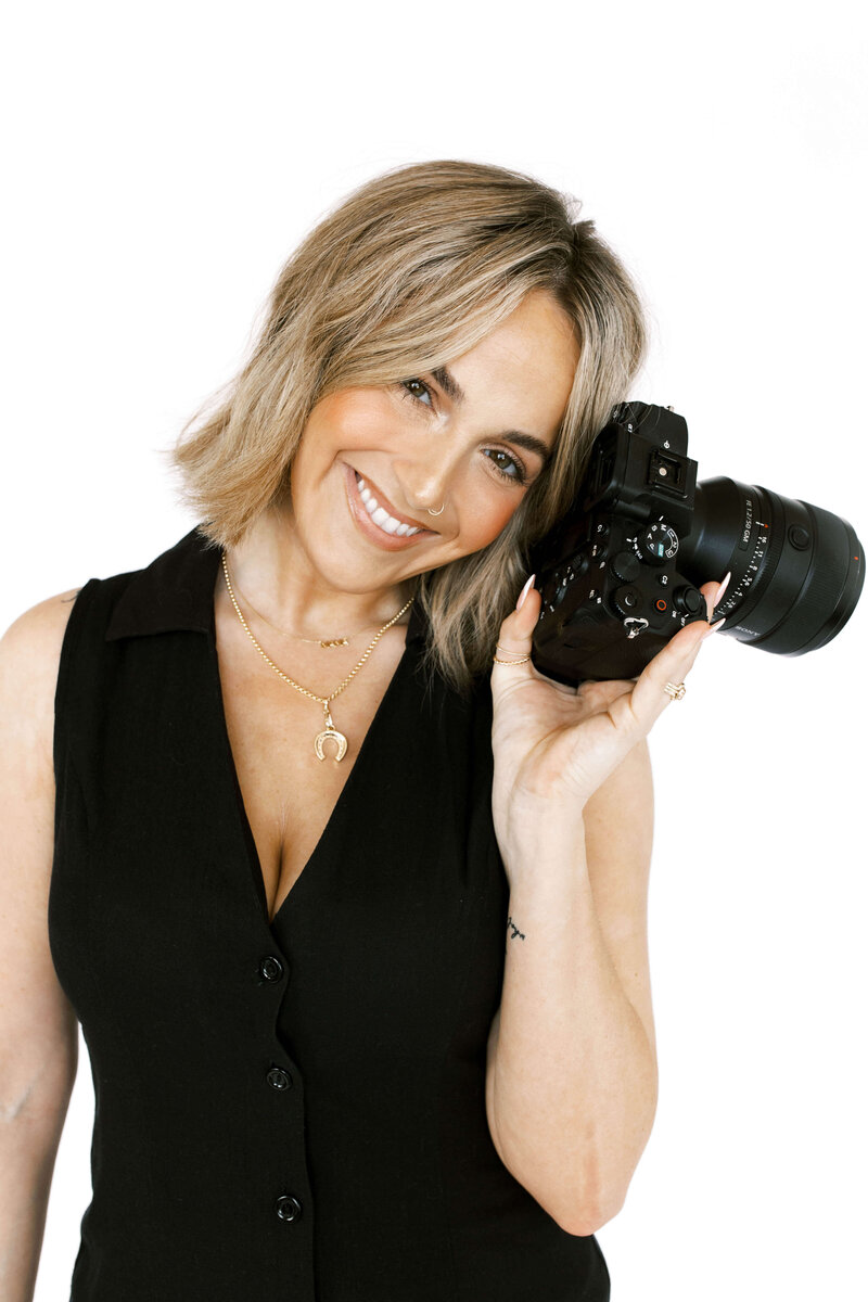 Victoria Ashley, DFW senior  portrait photographer smiling during brand shoot. 