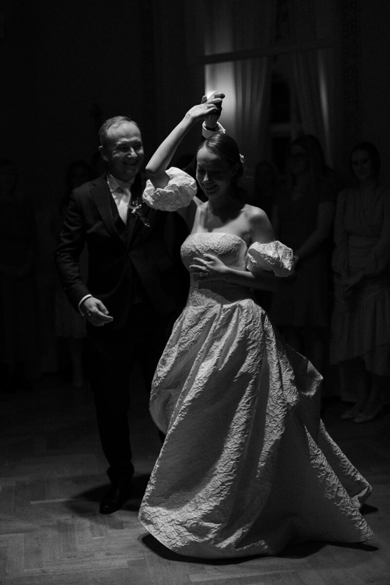 Luxury wedding in Europe – sophisticated bride in a modern wedding gown and groom in a timeless suit.