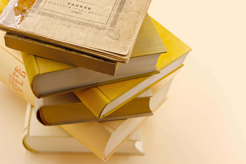 pile of yellow vintage books