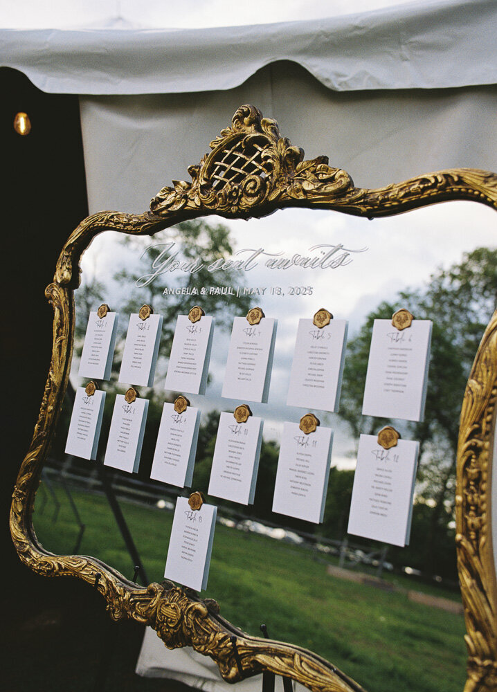 wedding guest seating chart on a mirror