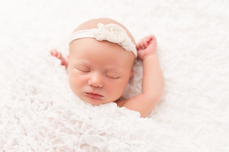 Newborn girl in white