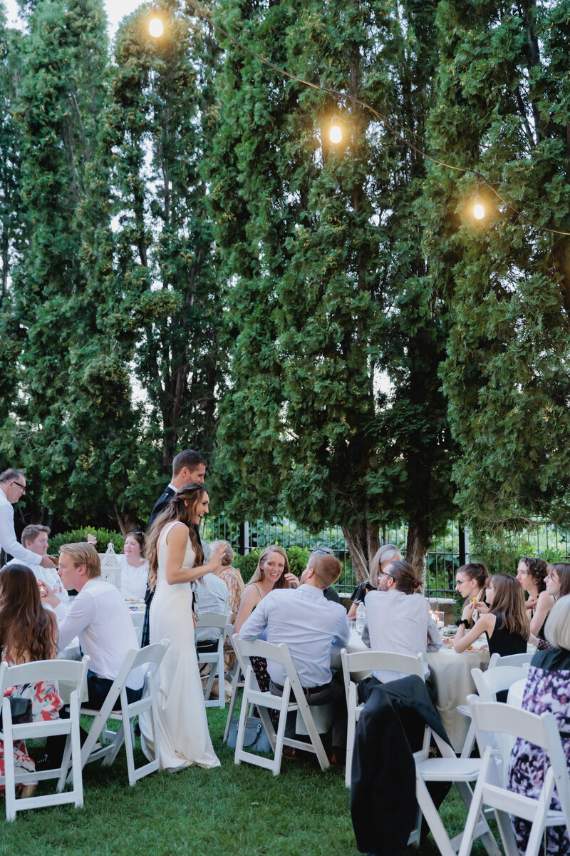 Guest mingle in the garden during sunset