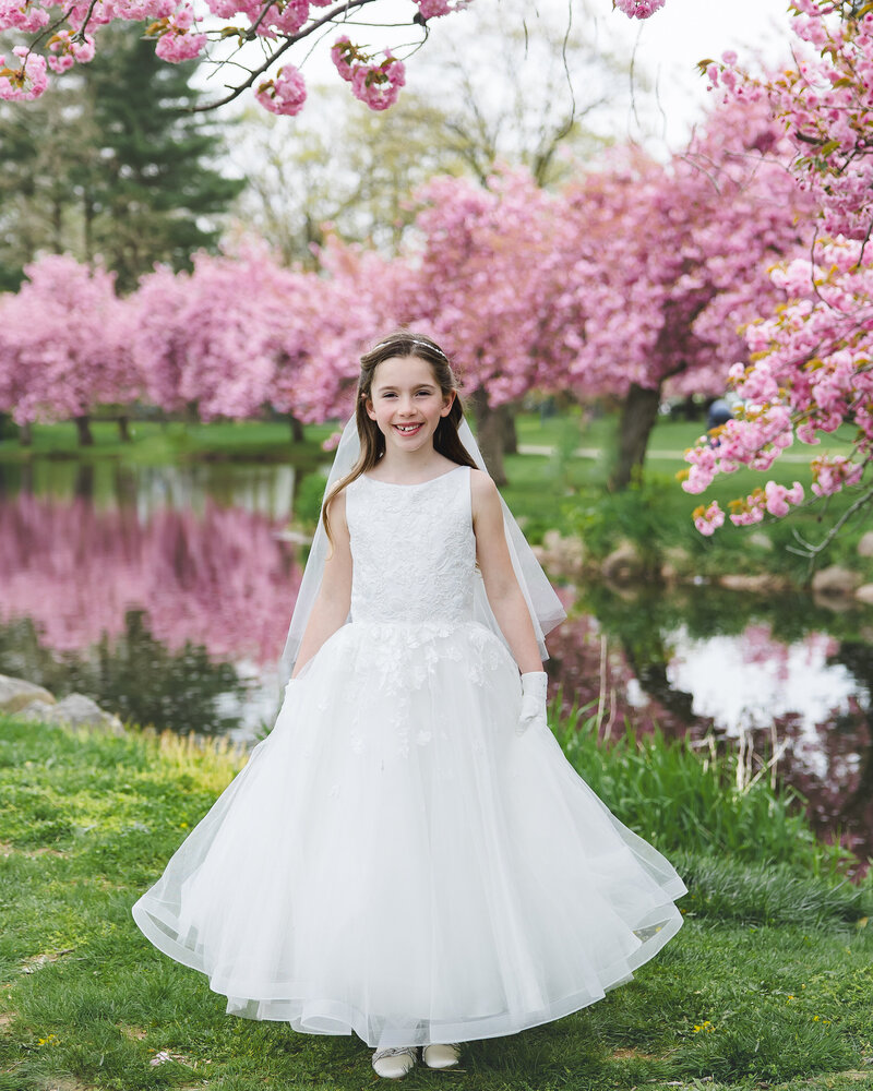 First Communion photo of girl in a NJ park.