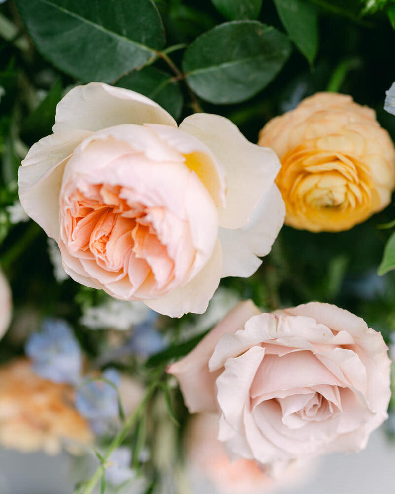 A detailed close-up photograph of a stunning wedding bouquet from a bride married at the Post Hotel in Lake Louise, showcasing timeless floral elegance.