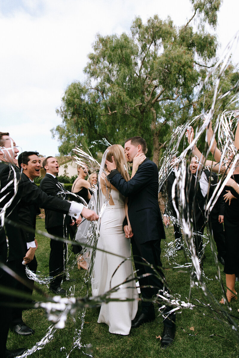 Joyful wedding celebration with bride and groom at Estancia La Jolla by Rachael Marie Photography