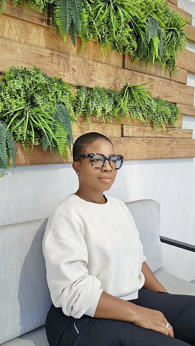 Michelle standing in a modern apartment kitchen
