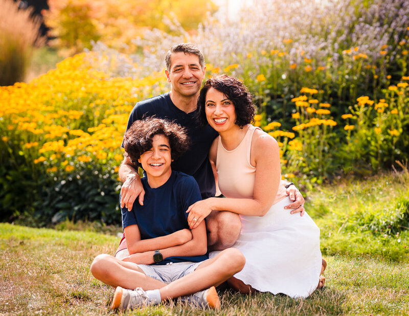Parents enjoying a PDA moment while their son comically expresses disgust!