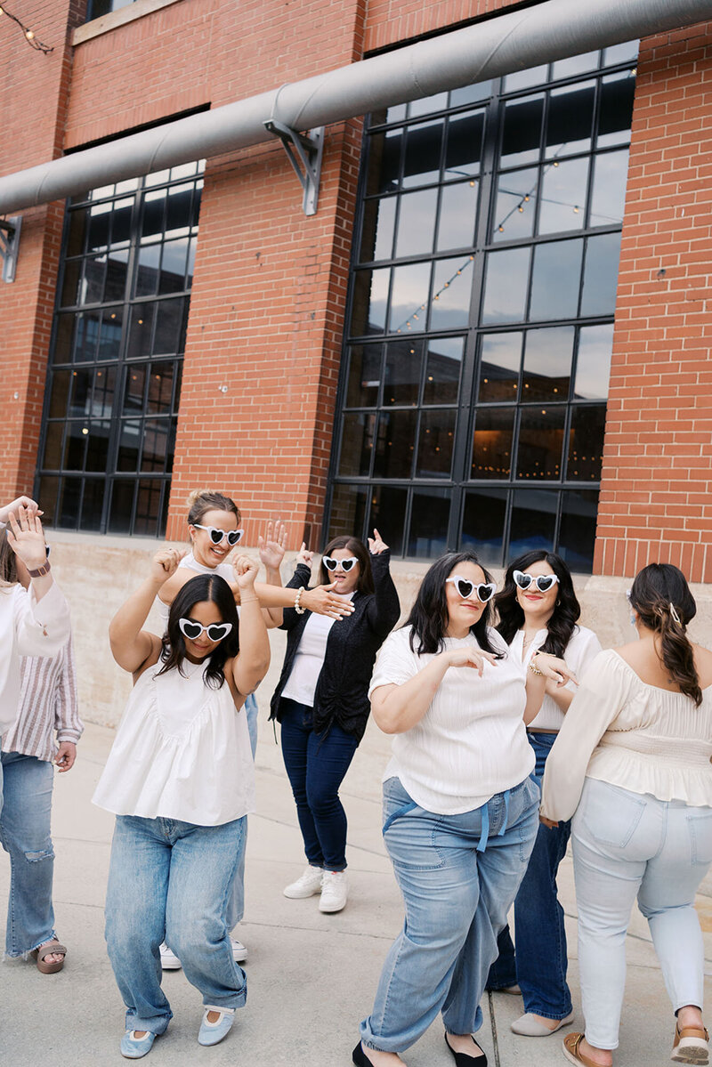 Raleigh event planners dancing outside