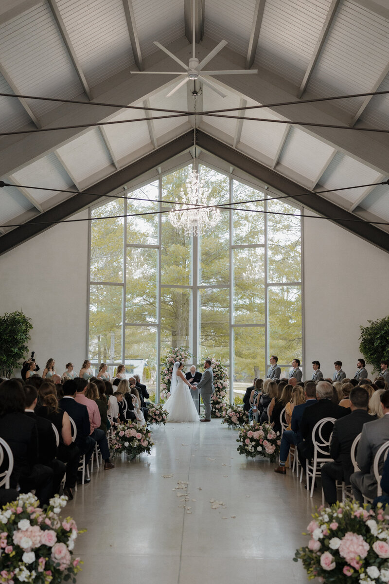 Bride and groom share a joyful first kiss during an Ontario wedding ceremony