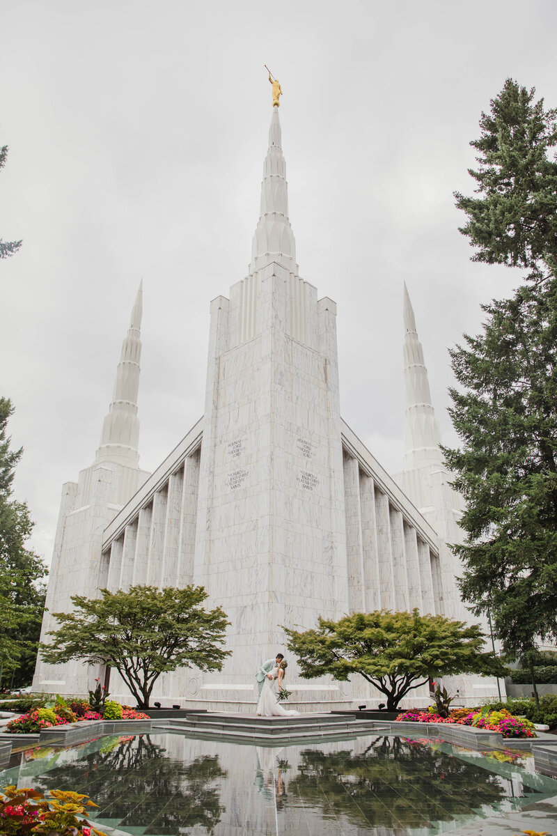 couple posing and celebrating outside LDS temple during Tennessee wedding