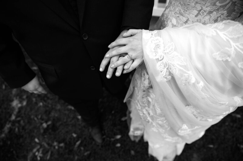 black and white image of bride and groom holding hands at Shawnee on Delaware PA
