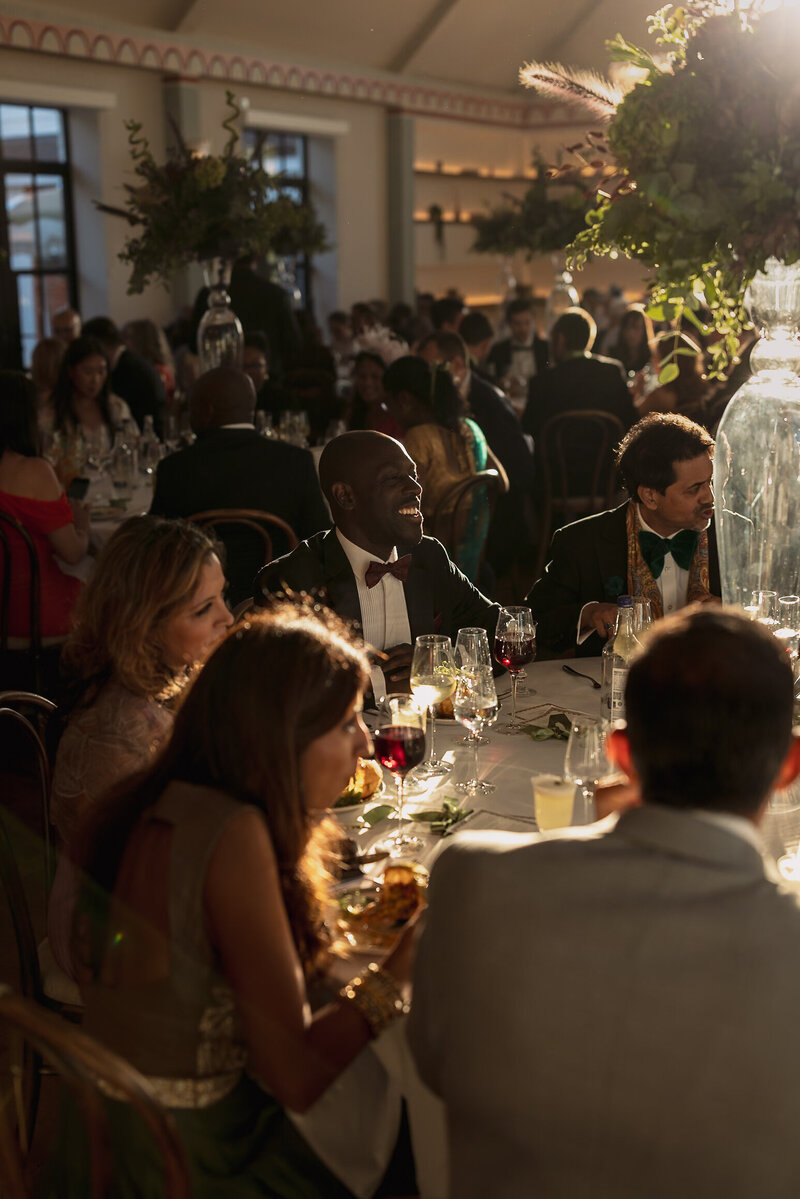 Wedding photographer captures couple taking a stroll hand in hand at their french chateau wedding.