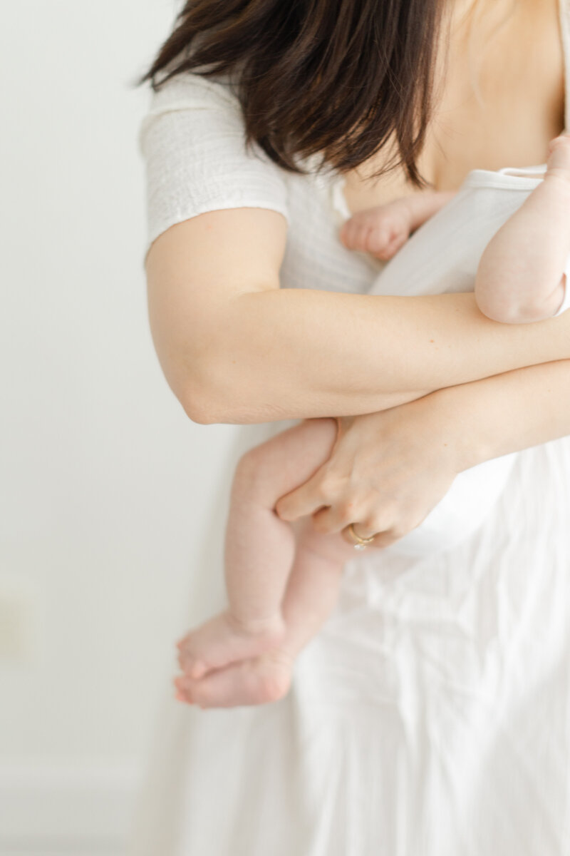 Mother holds her baby