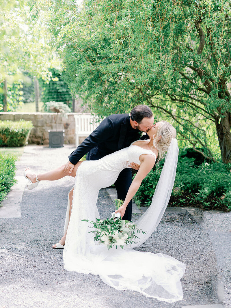 The couple share a sweet moment under the trees at their first look at Goodstone Inn.