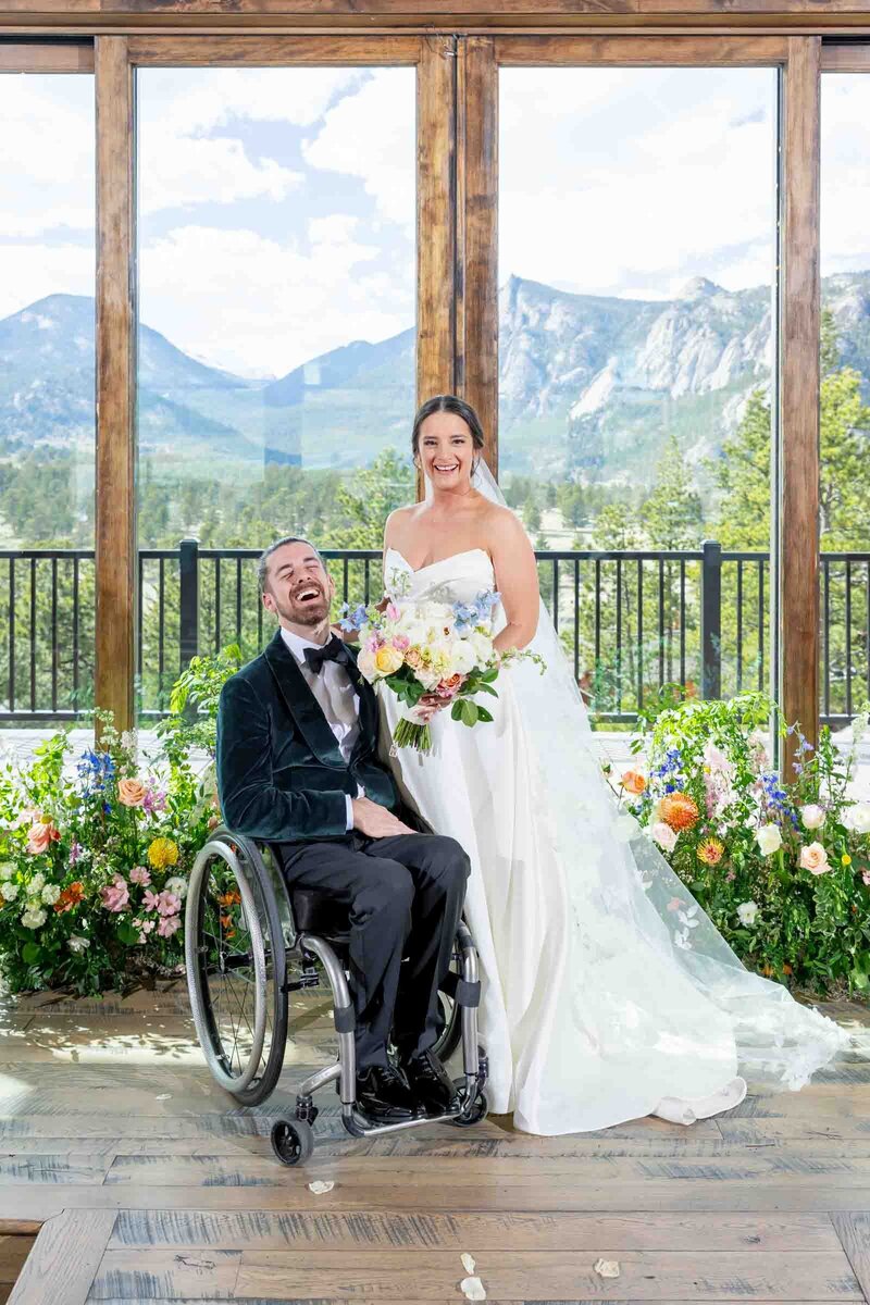 Bride and groom laughs at their altar at their Black Canyon Inn wedding. 