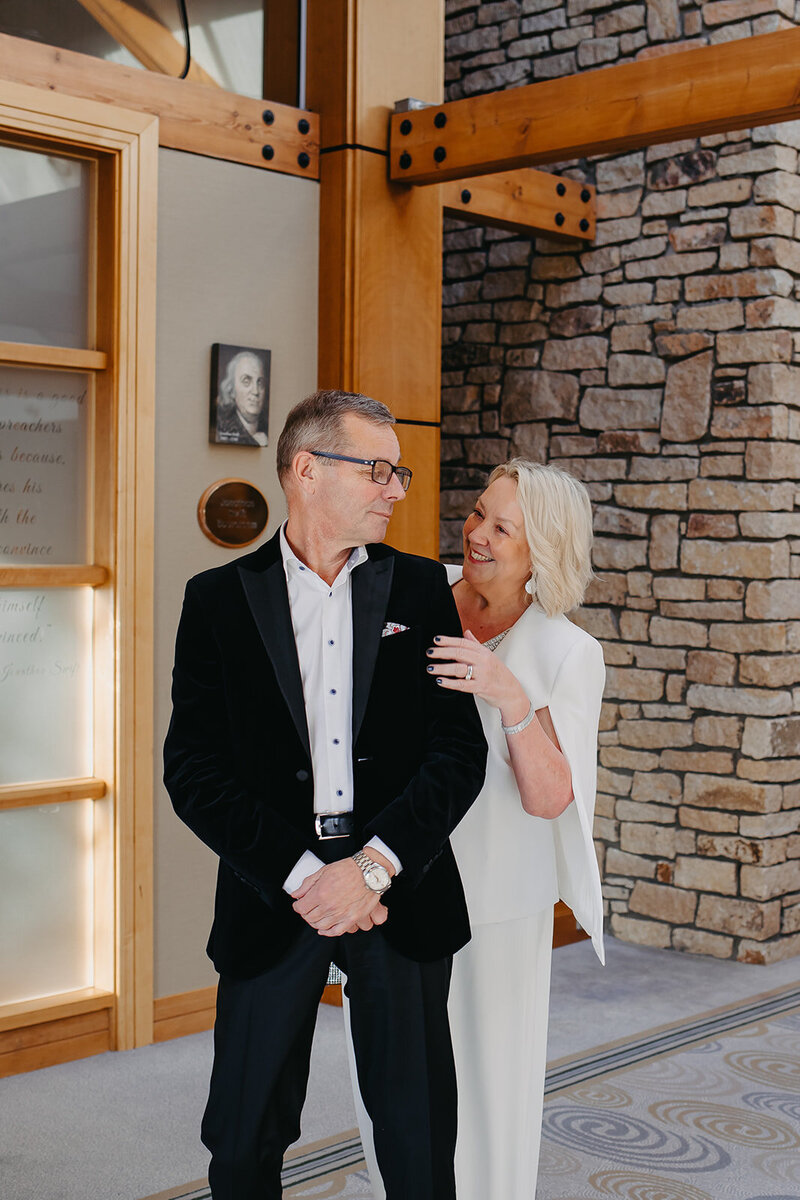 First look moment inside a hotel in Dublin, capturing a joyful and emotional exchange between a couple over 55 seeing each other for the first time on their wedding day